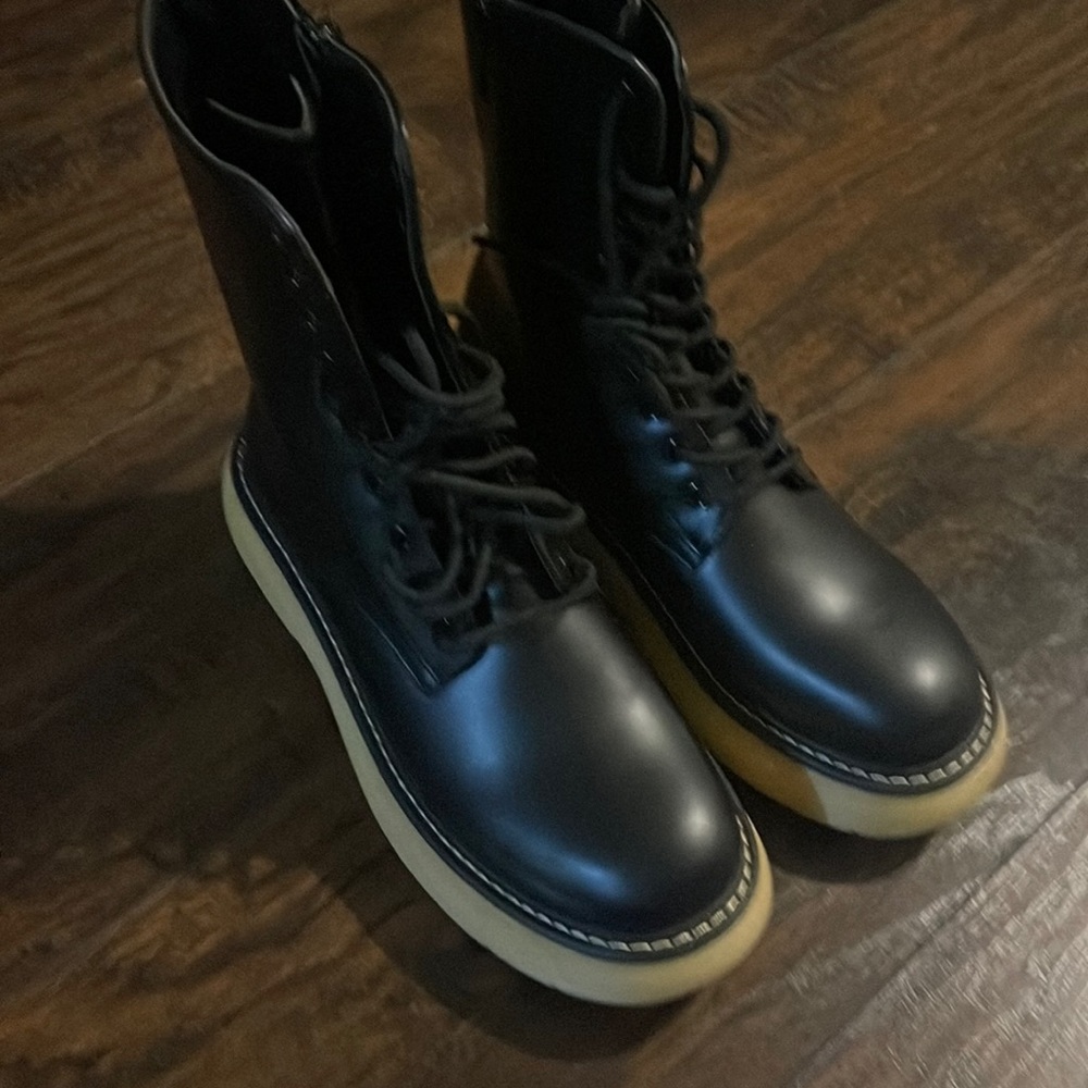 Selling brand new black boots because they say size 10 but fit like 8